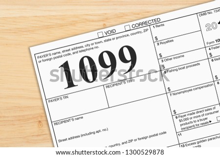 A US Federal tax 1099 income tax form on a desk Royalty-Free Stock Photo #1300529878