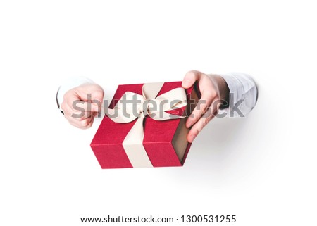 Man holding a gift box on white background.