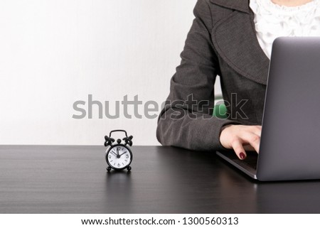 Time Management concept. Business woman with laptop