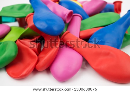 Multi-colored inflatable rubber balls, folded slide.