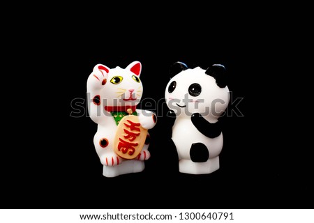The maneki-neko chineses Waving cat and panda