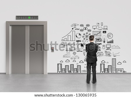 businessman looking at drawing business plan