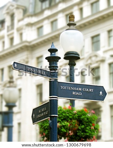 London Street Signpost with Bond street and Tottenham Court road Royalty-Free Stock Photo #1300679698