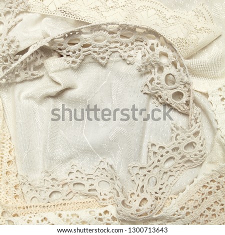 Old Style background: brocade or damask fabric with ancient laces.