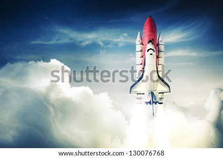 Space shuttle taking off on a mission Royalty-Free Stock Photo #130076768