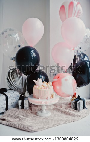 Holiday for girl - balloons and princess cake on a white background