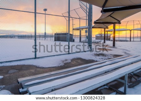 Snowy baseball field at sunset in Eagle Mountain