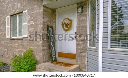 Decorated doorway and reflective windows of a home