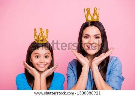 Close-up portrait of two nice cute sweet delighted pretty lovely attractive funny cheerful cheery positive glad straight-haired girls wearing crowns isolated over pink pastel background