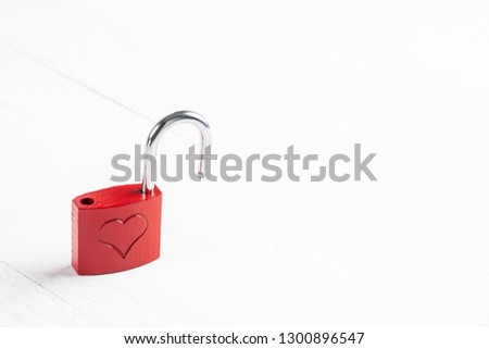 Red padlock with heart for special day like valentines day, christmas or wedding, isolated on a white background