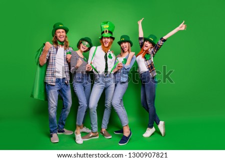 Full length body size photo cheer five company celebrate winning hands arms up spend holiday tradition national specs casual outfit saint paddy day laugh laughter isolated on bright green background