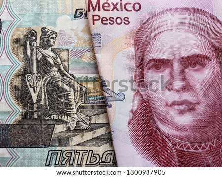 approach to russian banknote of fifty rubles and mexican banknote of fifty pesos 