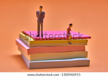 figures of people and stickers on an orange background