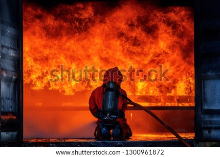 
Fireman Is extinguishing a fire that burns violently