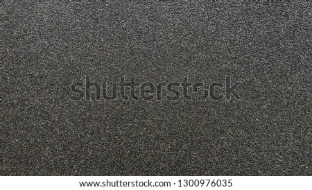 Coarse sand paper close up background texture.