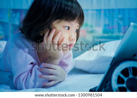 asian girl playing smartphone, kid use telephone, watching tablet, watching cartoon
