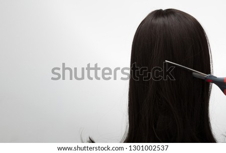 Artificial Fake Hair Wig on Rattan Head Mannequin wooden stand, studio lighting isolated on white gray close up detail of hair copy space text logo, color black curl straight top, professional scissor