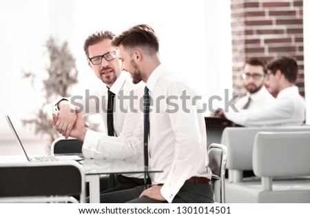 handshake employees at the Desk