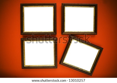 empty picture frames on wooden wall