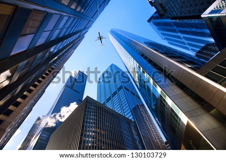 Looking up at Chicago's skyscrapers in financial district, IL, USA Royalty-Free Stock Photo #130103729