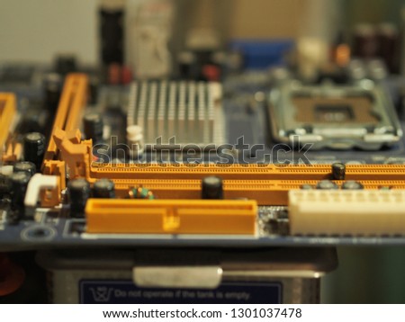 The electronic circuit board in the old computer is damaged.