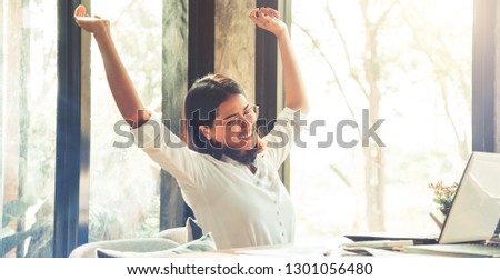 Happy, Excited, Successful businesswoman in coffee cafe, vintage colors