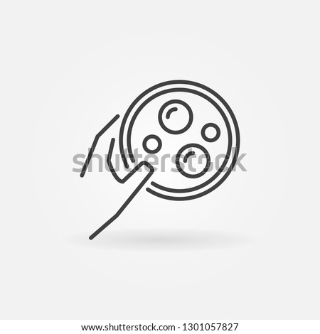 Hand holding Petri Dish vector icon or design element in thin line style