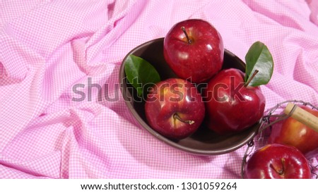 Apple on plate. Photoshoot pink background