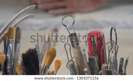Artist working in a ceramic workshop, france