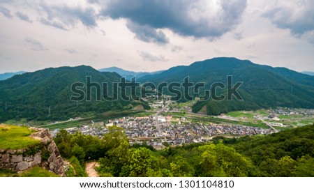 Landscape wide-angle photo of the panoramic view taken from the top of Takeda Castle Ruins located in Hyogo Prefecture's Asago City in Japan, which is a famous and popular side trip from nearby Himeji