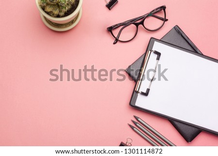 Blank clipboard paper on pink pastel background, copy space