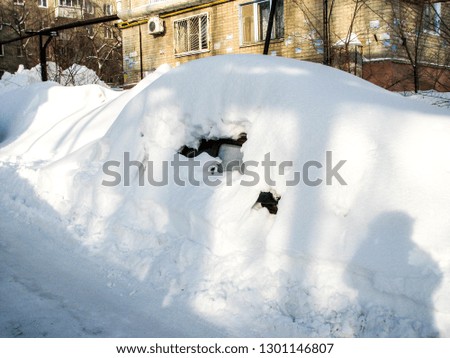 cars covered with snow. winter. bad weather