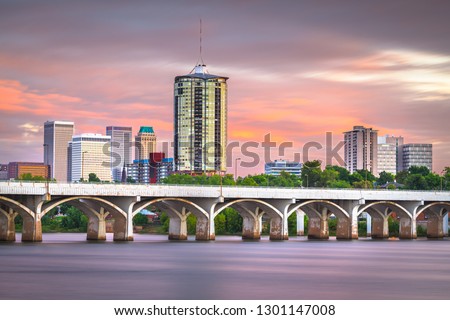 Tulsa, Oklahoma, USA downtown skyline on the Arkansas River at dusk. 