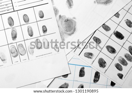 Police forms with fingerprints, top view. Forensic examination Royalty-Free Stock Photo #1301190895