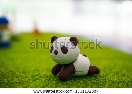 Cute little Panda : small figurines of animals, stone figure statue, object macro , toy animals.
