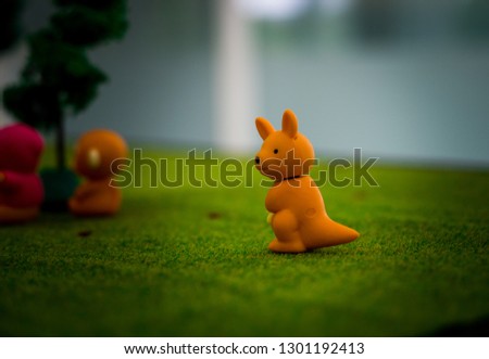 Cute little kangaroo : small figurines of animals, stone figure statue, object macro , toy animals.