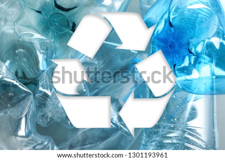 Symbol of recycling and plastic bottles, closeup