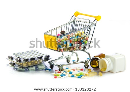 shopping cart full of pills isolated on white. Shopping cart with medicine pills