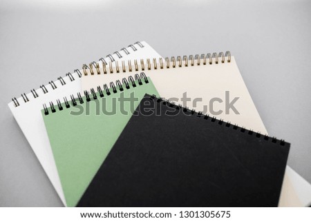 Stationary concept, Flat Lay top view Photo of notepads  on beige background with copy space.
