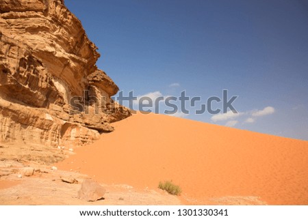 desert outdoor picturesque scenery landscape with yellow dunes and mountain and blue sky