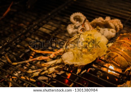 Grilled sliced lobster BBQ on grille. The picture refer to BBQ party.