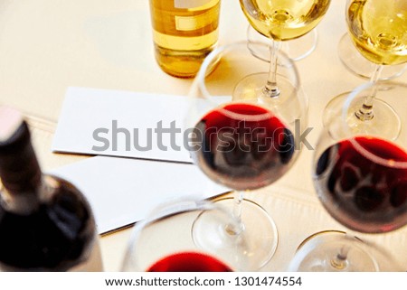 glass and bottle of white wine with copyspace empty wine label.
