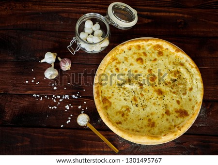 Delicious Italian pizza with cheese on a wooden table