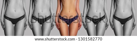Sports girl on a black and white background. blue panties, sports theme. Weight loss. Female body. women's hands measure the waist and legs with a measuring tape