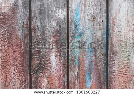 Wooden background of weathered painted planks.