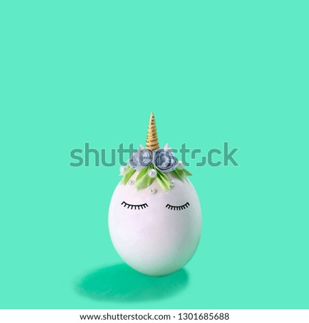 Cute handmade unicorn made of egg. Creative Easter decor, kawaii style. Minimal easter concept