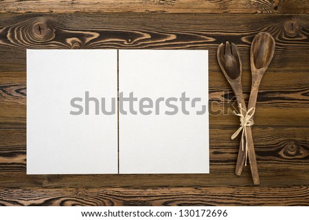 Blanc paper on rustic wooden background
