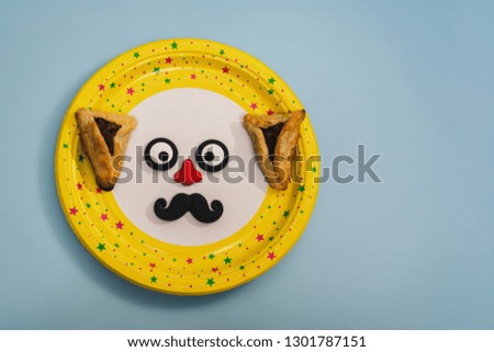 Funny eyes with nose and moustache for a masquerade, on a yellow background