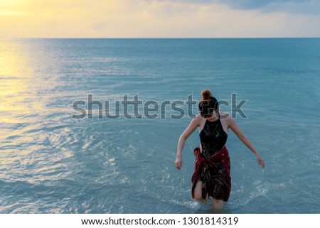Portrait of cute asian woman with background of beautiful ocean wave