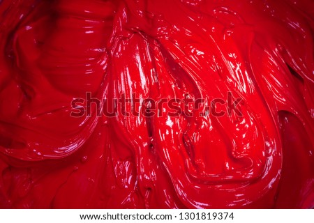 close up red color of oil paint. ink of screen printing  for print on tee shirts and fabric 